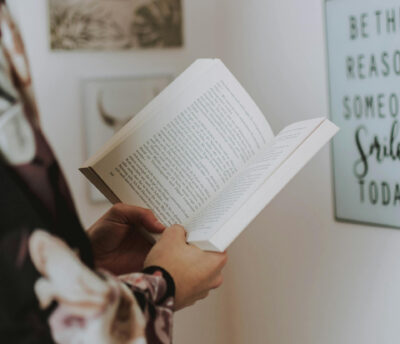 A book being held in a person's hands