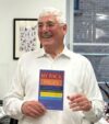 Photograph of Richard Charkin holding his book My Back Pages