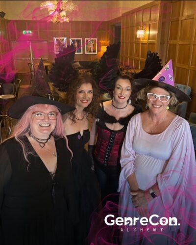 a portrait of four QWC staff members dressed up for GenreCon