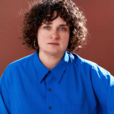 Photo of writer Romy Ash in blue shirt.