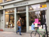Photo of man walking past Waterstones store