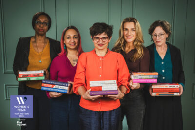 A photo of the Women's Nonfiction Prize judges holding the longlisted titles.