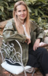Photo of Hannah Goldstein sitting on a chair
